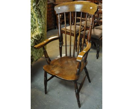 20th Century stained beech and elm stick back fireside elbow chair on baluster turned legs. (B.P. 21% + VAT)