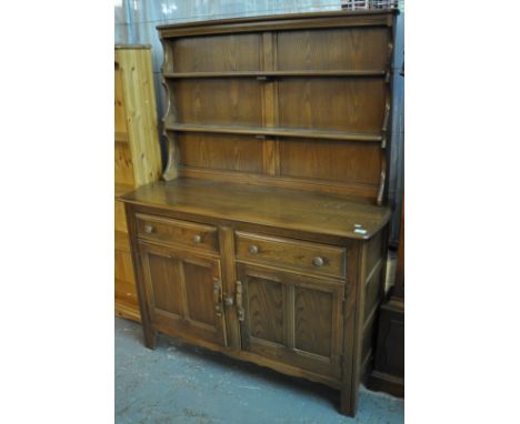 20th Century Ercol elm 'Colonial' dresser with two shelf rack back. With original bill of sale showing purchase price of £125