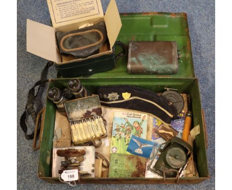 Military tin two-handled box marked 'P60 MCII 1943' to the front. Interior reveals assorted items to include military and oth