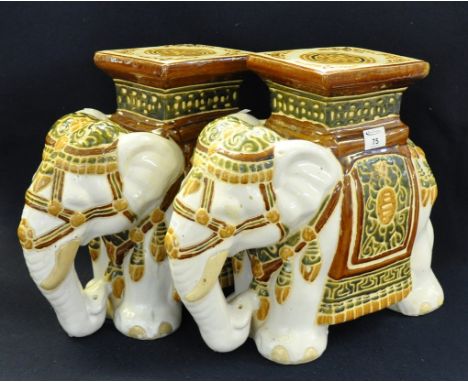 Pair of ceramic conservatory seats or lamp tables in the form of Indian elephants. (2) (B.P. 21% + VAT) No obvious damage.39c