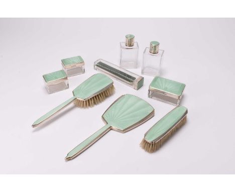 A nine piece silver and green guilloche enamel dressing table set, Adie Brothers, Birmingham 1937 and 1938, comprising; a han
