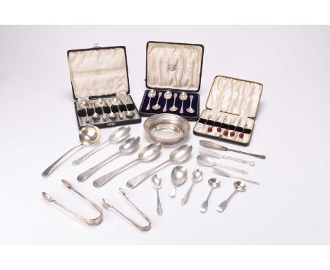 A collection of silver flatware, comprising; three provincial dessert spoons, stamped 'JM' 'JM', a George III sauce ladle, a 