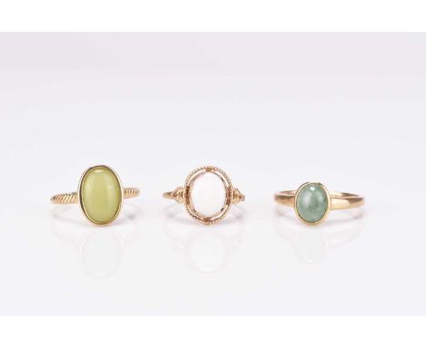 A 9ct gold opal ring, size S, together with a 9ct gold jade cabochon ring, size S, and a further 9ct gold stone set ring, siz