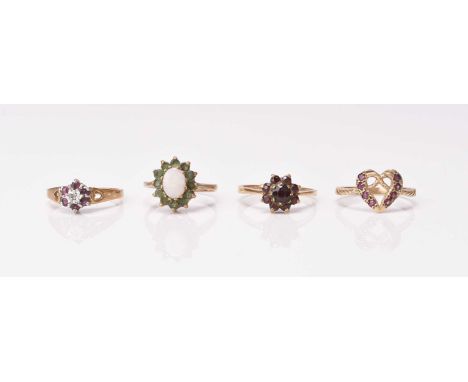 Four 9ct gold stone set rings, comprising; a diamond and ruby cluster, size L 1/2, an opal and emerald cluster, size L 1/2, a