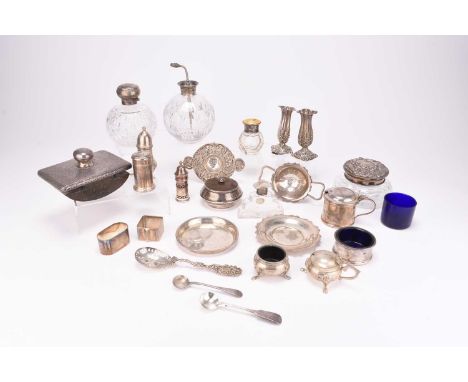 A collection of silver wares, comprising; a matched silver cruet set, a pair of silver bud vases, two napkin rings, a sugar s