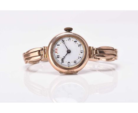 Etna: A lady's 9ct gold bracelet watchDate: Circa 1919Movement: 15-jewel manual windDial: White enamel, black Arabic hour mar