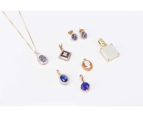 A 9ct gold sapphire and diamond pendant, together with a yellow metal mounted lapis lazuli pendant stamped ‘9k’, a blue stone