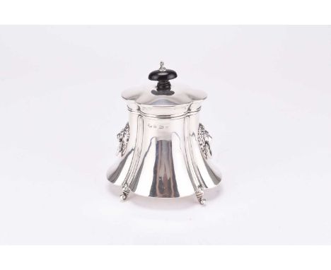 An Edwardian silver tea caddy, William Adams Ltd, Birmingham 1903, of quatrefoil form with two lion mask loop handles, raised