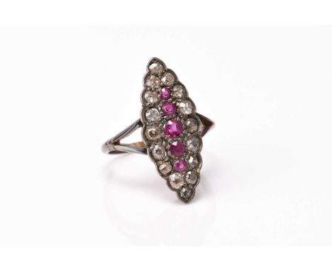 A diamond and untested ruby cluster ring, of marquise form, set in yellow and white metal, not stamped, ring size M, weight a