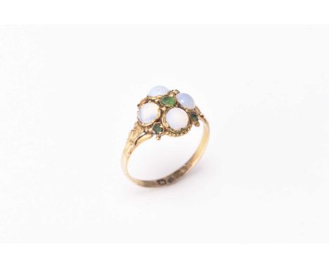 A 19th century cluster ring, designed as four opaline cabochons interspersed with green paste and mounted to yellow metal sha