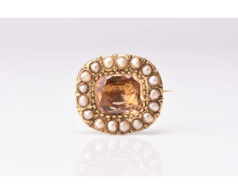 A 19th century citrine and half seed pearl set brooch, the central cushion cut citrine claw set within a surround of seventee