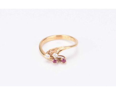 A diamond and ruby stylised crossover ring, indistinctly stamped, ring size M, weight 2.6g