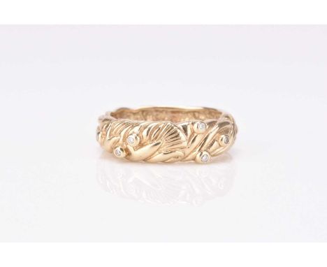 A 9ct gold diamond set band, possibly Clogau Welsh gold, the decorative band set with six brilliant cut diamonds, ring size O