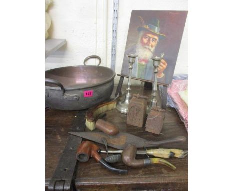 Mixed metalware to include a Victorian twin handled cooking pan, together with pipes and an unframed oil of a gent smoking a 