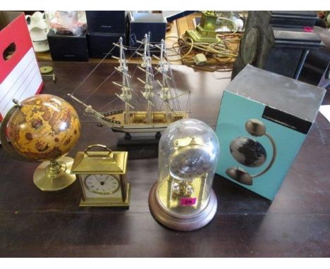 Mixed items to include a floating magnetic globe, an anniversary clock, a model of a ship, a carriage clock and a small globe