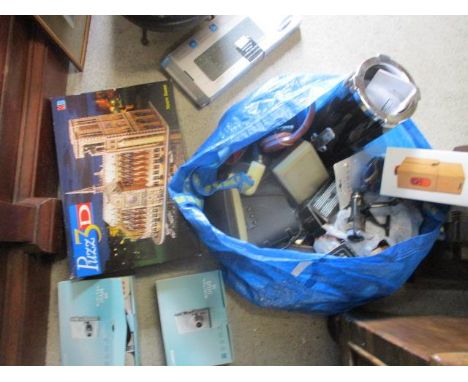 Electrical items to include a Canon IXUS 55 and a 60, phone projector, a puzzle and other items 