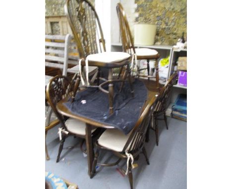 A set of six Windsor stick back chairs with crinoline stretchers and a 1930s mahogany gate leg table, 29 1/4" h x 56" w 