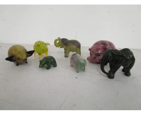 A group of seven jade, quartz, glass and stone carved animals to include elephants 