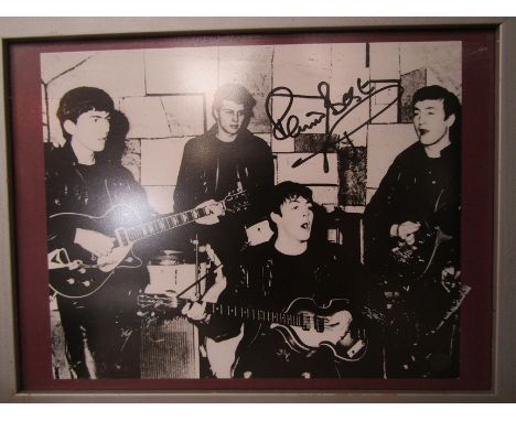 THE BEATLES: A framed and glazed photographic print of the band performing at the Cavern Club, signed by Pete Best, COA verso