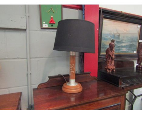An oak table lamp with tree motif 