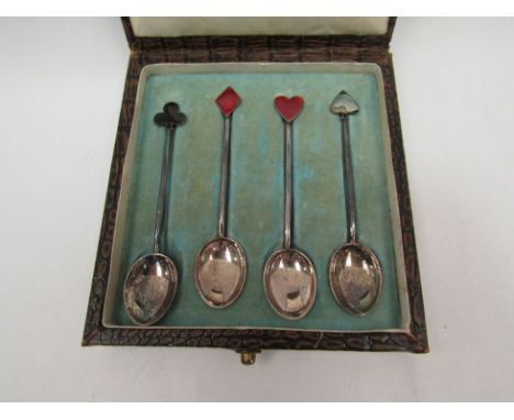 A set of four silver playing card design coffee spoons, enamelled terminals, one a/f 