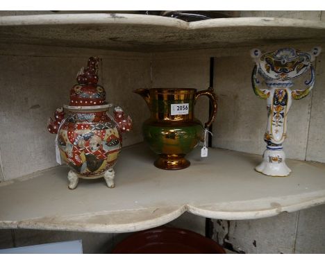A Winstanley Siamese crouching cat figure A/F, a satsuma lidded jar (lid restored), a quimper three handled candlestick and a