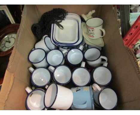 A box of enamel wares, mainly mugs 