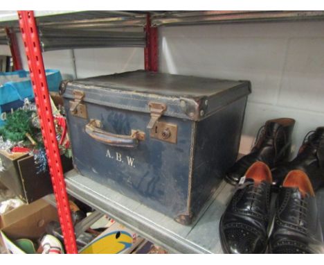 A monogrammed navy trunk containing an empty wooden box, RAF hat and a framed newspaper article aviation interest 