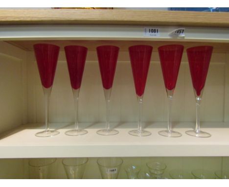 A set of six ruby &amp; clear glass champagne flutes 