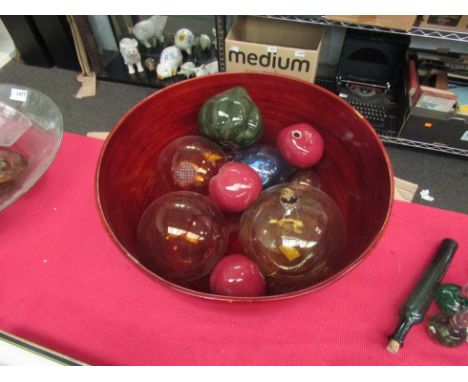 A large fruit bowl with glass balls and ceramic fruit 