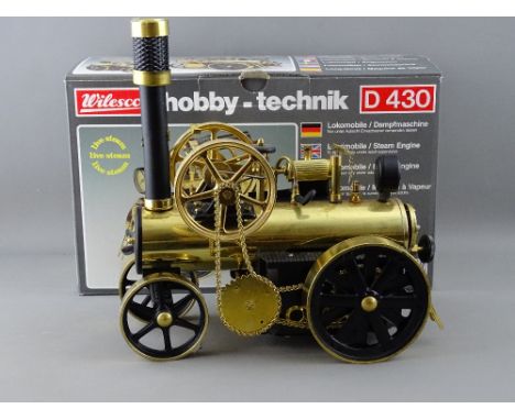 A WILESCO D430 LOKOMOBILE LIVE STEAM TRACTION ENGINE, appears unused with original box and instructions etc
