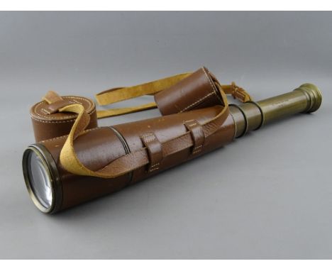 A LEATHER CASED FOUR DRAW TELESCOPE by Broadhurst, Clarkson & Co Ltd, London, with lens caps, 84 cms long extended