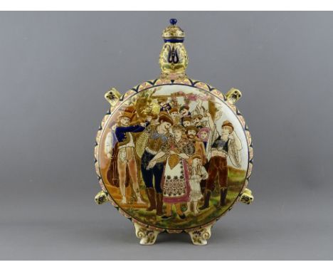 A ZSOLNAY PILGRIM KULAC (FLASK), moon shaped with panels depicting wedding and grape harvesting scenes, complete with stopper