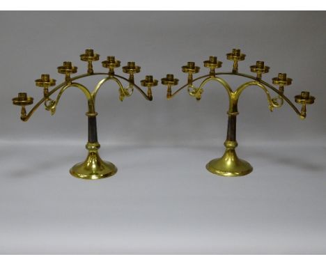 A GOOD PAIR OF VINTAGE BRASS ALTAR CANDELABRA, the circular bases with memorial inscription for 1953-1957, 41 cms high, 52.5 