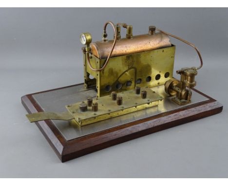A SCRATCH BUILT LIVE STEAM HORIZONTAL STATIONARY ENGINE with copper boiler and pressure gauge, over a six burner fuel tank, m