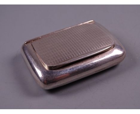 AN OBLONG SILVER SNUFF BOX with engine turned hinged lid, Birmingham 1930 by Charles Usher
