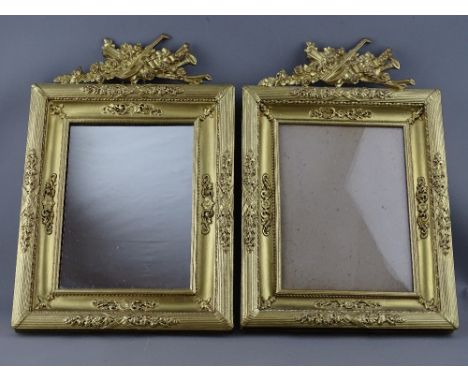 A PAIR OF GILDED BRASS EASEL PORTRAIT FRAMES/MIRROR having reeded and garland decoration with musical instrument and floral s