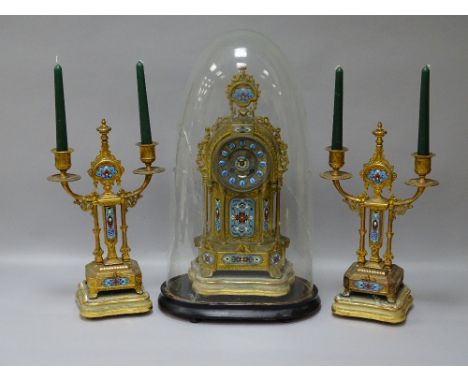 A 19th CENTURY GILT METAL & CHAMPLEVE ENAMEL CLOCK GARNITURE, the dial marked 'Nathan & Co' set with blue Roman numeral indic