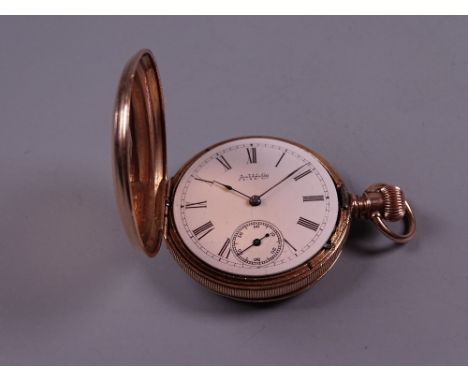 A LADY'S FOURTEEN CARAT GOLD ENCASED FOB WATCH with white enamel dial and sweep seconds dial, 1.8 grms gross
