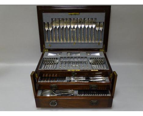 A SILVER ONE HUNDRED PIECE CANTEEN OF CUTLERY, the mahogany case having a stepped and hinged lid to a top tray and two drawer