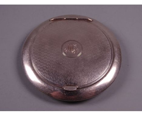 A CIRCULAR SILVER LADY'S POWDER COMPACT with engine turned lid and initials to the centre, 1.1 troy ozs, Birmingham 1937 by S