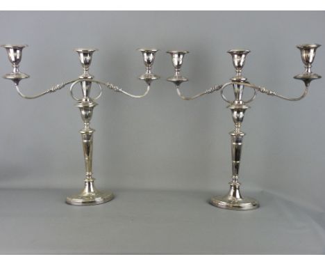 A GOOD PAIR OF ELECTROPLATE CLASSICALLY STYLED TWIN BRANCH CANDELABRA, 48 cms high overall