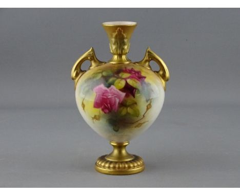 A ROYAL WORCESTER TWIN HANDLED VASE, 2249 shape, gilt decorated with floral body, 16 cms high