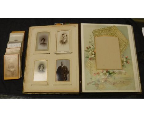 A Victorian gilded and embossed leather bound German photograph album with two air musical box playing "Home Sweet Home" and 