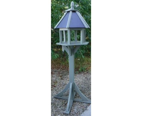 A painted pine bird table of architectural form