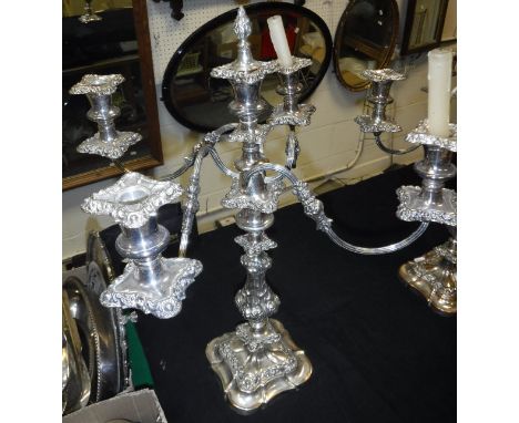 A pair of plated four branch five light candelabra