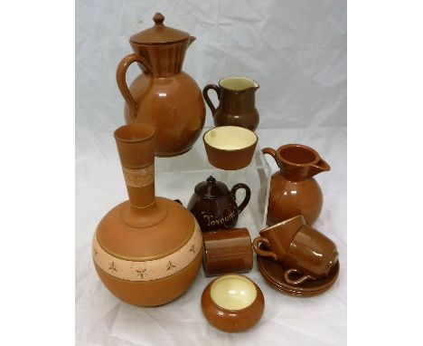 A Watcombe of Torquay pottery terracotta ovoid vase with gilt banded decoration, together with cabinet jug marked "Widdecombe