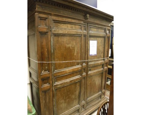 A late 17th / early 18th Century walnut kas or armoire, the moulded pediment over two doors to bracket feet CONDITION REPORTS