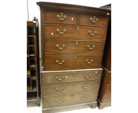 A 19th Century mahogany chest on chest, the upper section with two short over three long drawers, the base of three long draw
