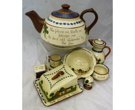 A collection of Devon Motto ware to include a large teapot marked "No place on earth so pleases me as dear old Salcombe by th